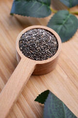 close up of chia seed in wooden spoon 