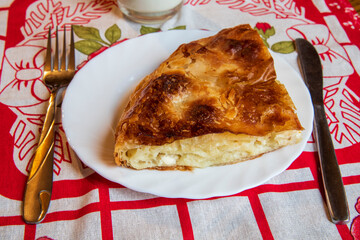 Fresh made chesse pie, preparation for eating...burek sa sirom...peynirli börek...