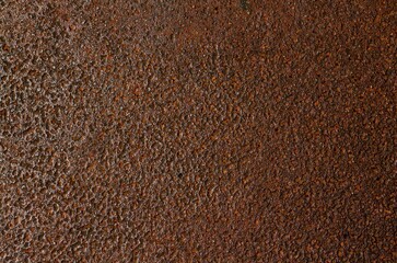 Rusty grunge on dark metal texture background.