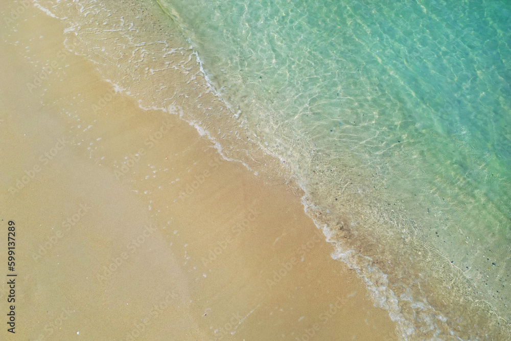 Wall mural aerial view with drone ,of waves on tropical white sand beach 