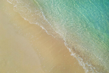 aerial view with drone ,of waves on tropical white sand beach 