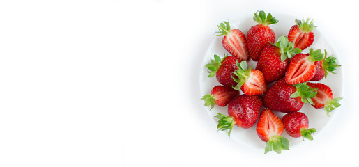 Fresh strawberries flat lay close-up on a white isolated background. extra wide banner . Fresh berries, summer harvest, fruits, healthy food, diet concept. copy space for text