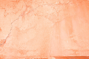 Orange coloured weathered painted wall for background