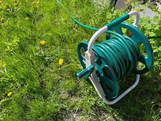 Lawn watering hose. Hose with water. Gazog