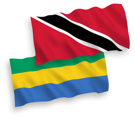 Obraz premium Flags of Republic of Trinidad and Tobago and Gabon on a white background