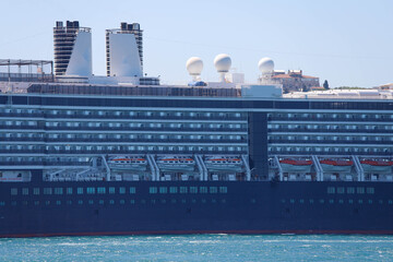 Fototapeta premium Cruise ship in city port in city port for tourist travel on sunny day. It waits at the port of Galataport , the tourist port of Istanbul.