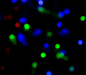 colorful flashes of lights on a black background.