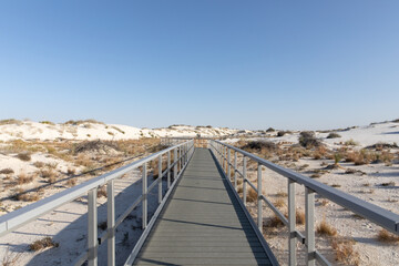 Fototapeta na wymiar Metal Boardwalk over Sand Dunes at White Sands National Park