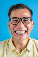 Man with eyeglasses and a shirt standing