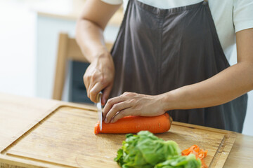 Prepare food  woman is preparing vegetable salad in the kitchen Healthy Food Healthy Cooking