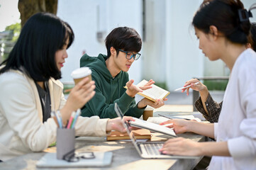 Image of a group of college students preparing for the exam together