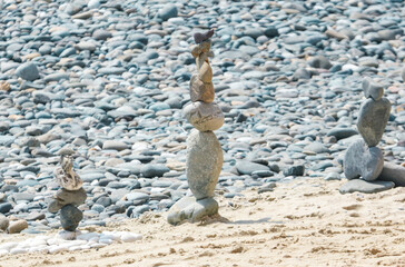 Pyramid of stone pebbles on the beach