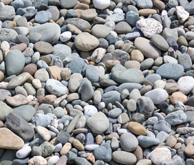 Fototapeta na wymiar Stone pebbles as an abstract background. Texture.