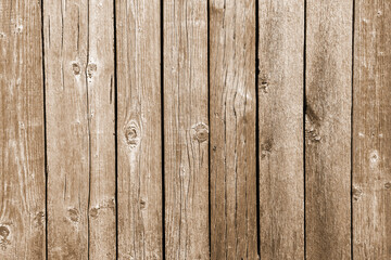 Brown background texture of vertical wooden slats. Old wooden boards.
