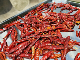 Organic dried chili on stainless steel tray
