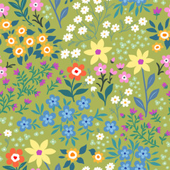 Seamless pattern. Vector flower design with cute wildflowers. Romantic abstract floral pattern on a green background. Illustrations of spring nature with red, blue, yellow, purple and orange flowers.