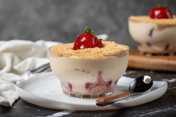 Strawberry magnolia. Magnolia dessert in bowl with cream and strawberry. Close up