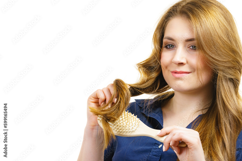 Poster Woman brushing long healthy brown hair