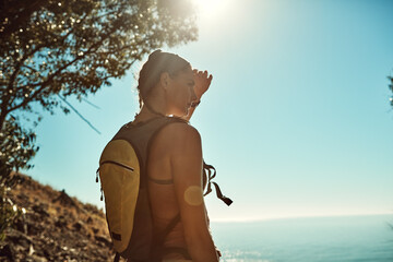 Go out and discover the wonder of the world. Rear view shot of a young woman admiring the view from...