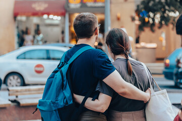 Young couple standing in an embrace in the city