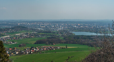 Obraz premium Frydek-Mistek city from lookout tower on Kabatice hill in Palkovicke hurky mountains in Czech republic