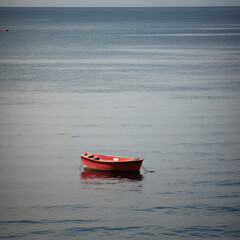 small red boat on the sea