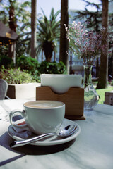 A cup of coffee on a summer terrace in a cafe