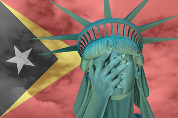 Statue of Liberty. Facepalm emoji on background in colors of Timor East flag