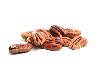 Peeled pecan nuts isolated on a white background. Heap of pecan halves