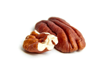Peeled pecan nuts isolated on a white background. Heap of pecan halves