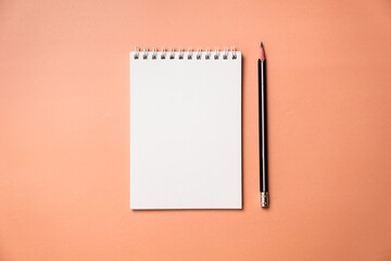 Planning, business, office work, stationery, or an education concept: on top is an image of an open notebook with a blank page, ready for addition or layout. Top view of stationery