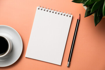 Planning, business, office work, stationery, or an education concept: on top is an image of an open notebook with a blank page, ready for addition or layout. Top view of stationery