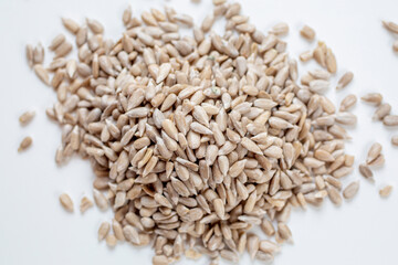 A pile of unroasted, cleaned sunflower seeds