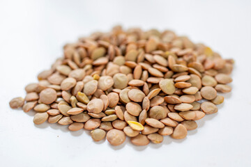 Brown lentils. Lentil cereal in a pile