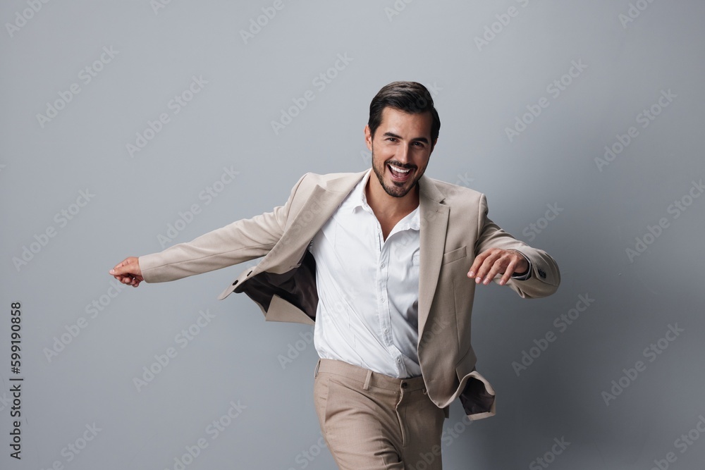 Wall mural man up beige running businessman happy winner hand victory business suit