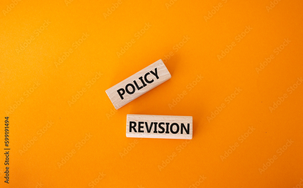 Canvas Prints Policy revision symbol. Concept word Policy revision on wooden blocks. Beautiful orange background. Business and Policy revision concept. Copy space