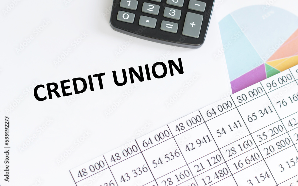 Poster credit union - text concept on notepad. the inscription credit union on a notepad next to the calcul