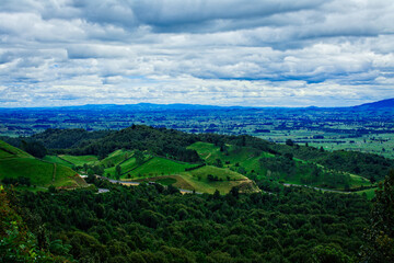Fototapeta na wymiar The Kaimai Range is a mountain range in the North Island of New Zealand. Beautiful green mountain landscape with forests and meadows