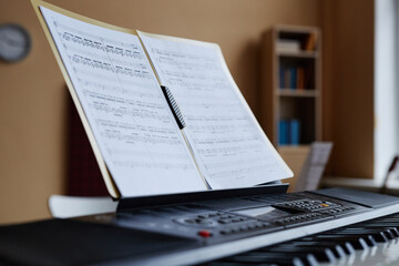 Close-up of sheet music for playing music on piano in music class