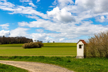 Obraz premium Small chapel in springtime field.