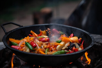 Thai Wok Recipe with Vegetables. Thai wok recipe with vegetables being cooked on an open fire, representing the delicious flavors of Asian cuisine. Ai generated