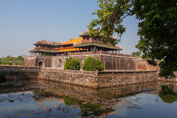 Fototapeta na wymiar Huế, Viet Nam: Ngọ Môn Gate, the main entrance to the Imperial City, with the Five-Pheonix Pavilion above and moat in the foreground.