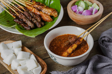Grilled food chicken and beef satay eaten with peanut sauce is famous Malaysian and Indonesian local dishes