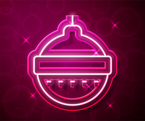 Glowing neon line Christmas ball icon isolated on red background. Merry Christmas and Happy New Year. Vector