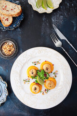 Scallop dishes.An exquisite dish is pan-fried scallops with mashed potatoes. Healthy food. Vertical photo on a blue background.