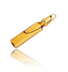 Yellow ampoule closeup with reflection isolated on white background
