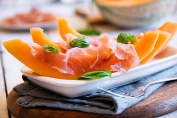 Prosciutto ham with melon, traditional italian dish