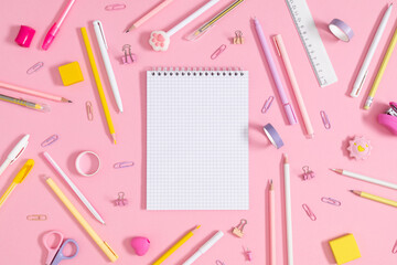 Back to school concept. Flat lay top view of scattered stationery notepad pens pencils paper clips ...