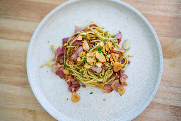 Top view of Spaghetti with bacon and fried garlic, delicious and easy-to-make pasta dish that is perfect for a quick weeknight meal