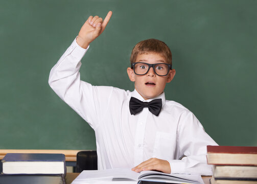 I know. A schoolboy wearing a bow-tie and glasses raising his hand to answer a question.